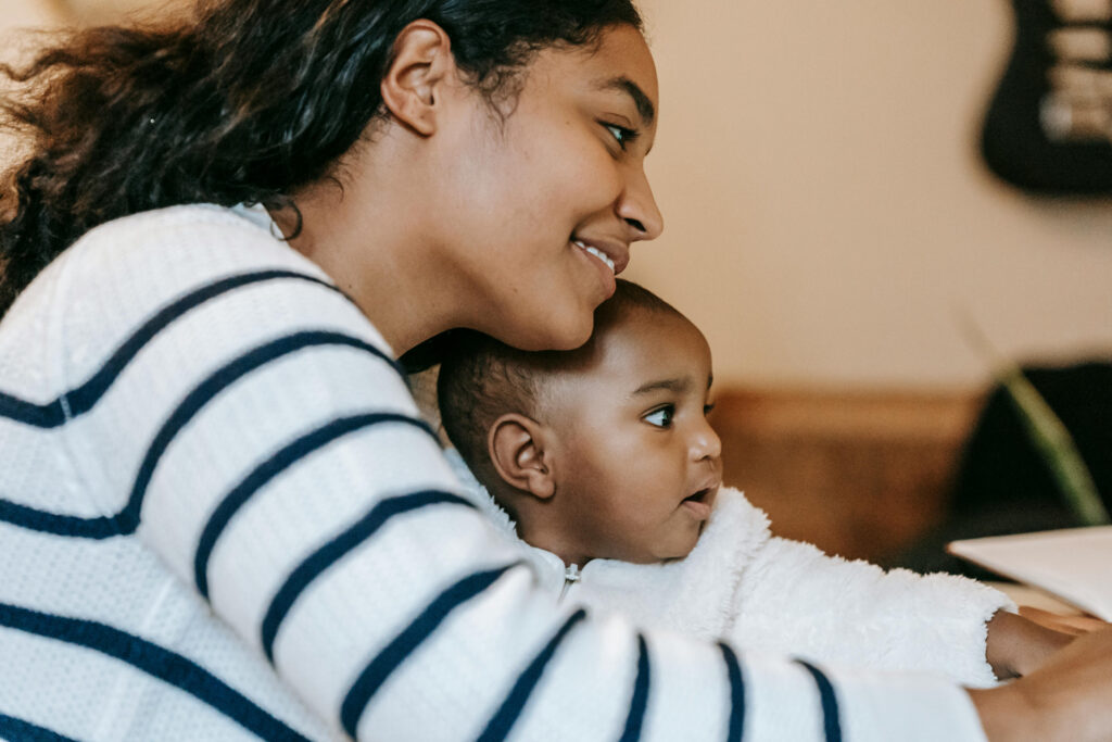 smiling mum engaged with baby