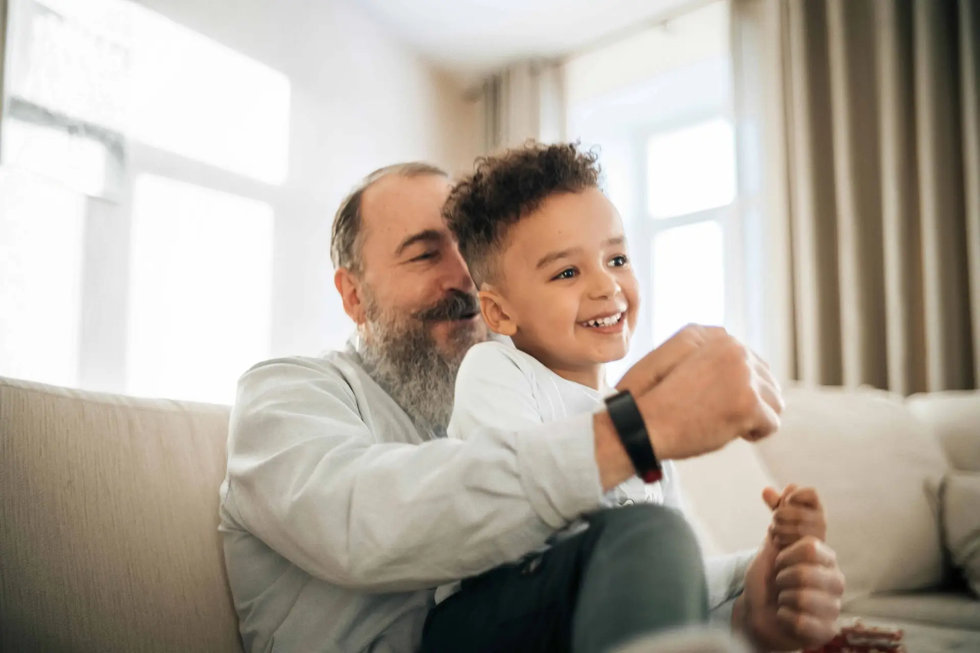 grandad with grandson smiling