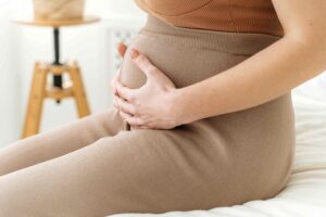 pregnant mother with hands on baby bump